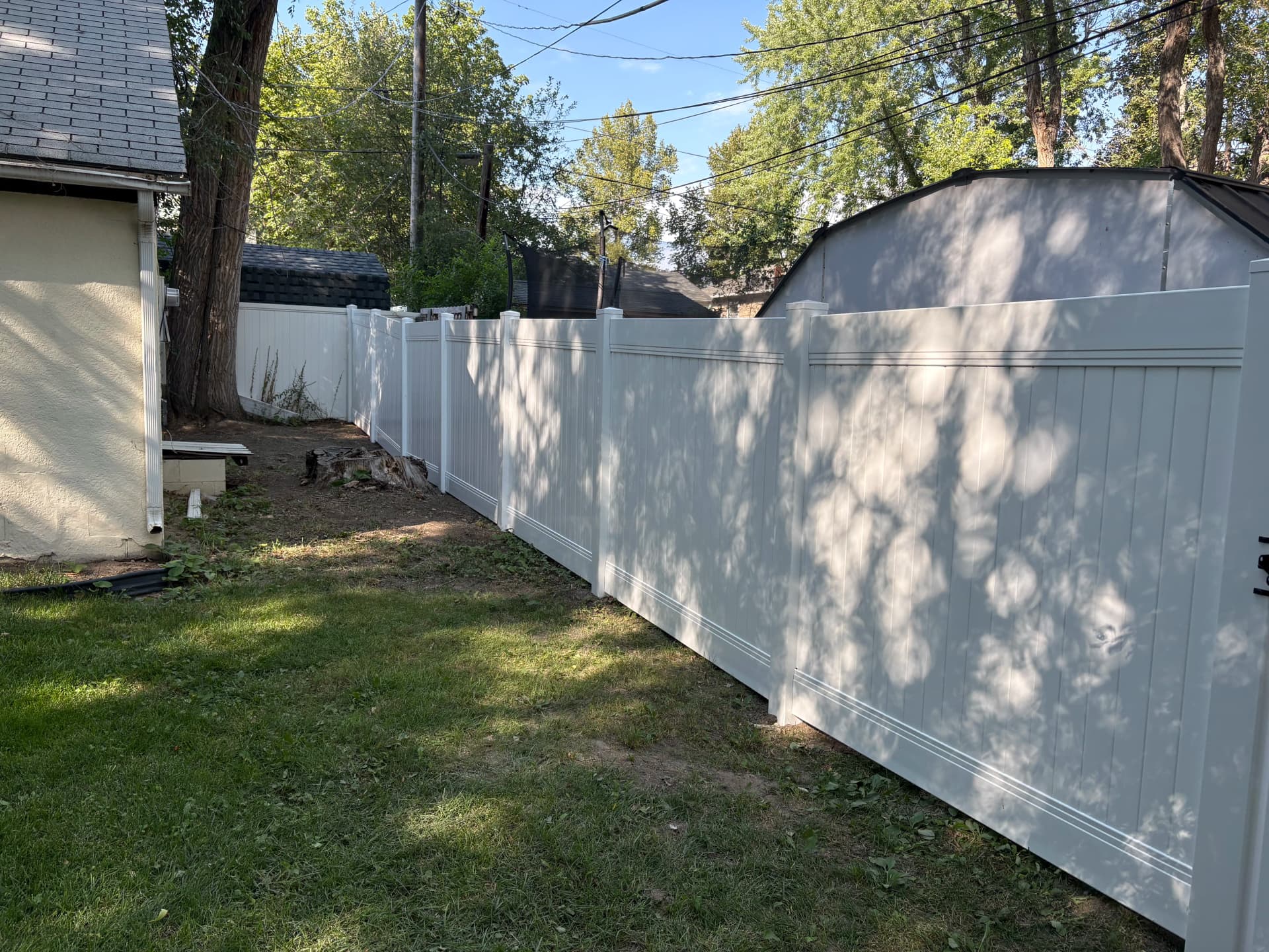 Gallery photos for Vinyl Privacy Fence and Gate Installation for a Family Backyard: Image #1