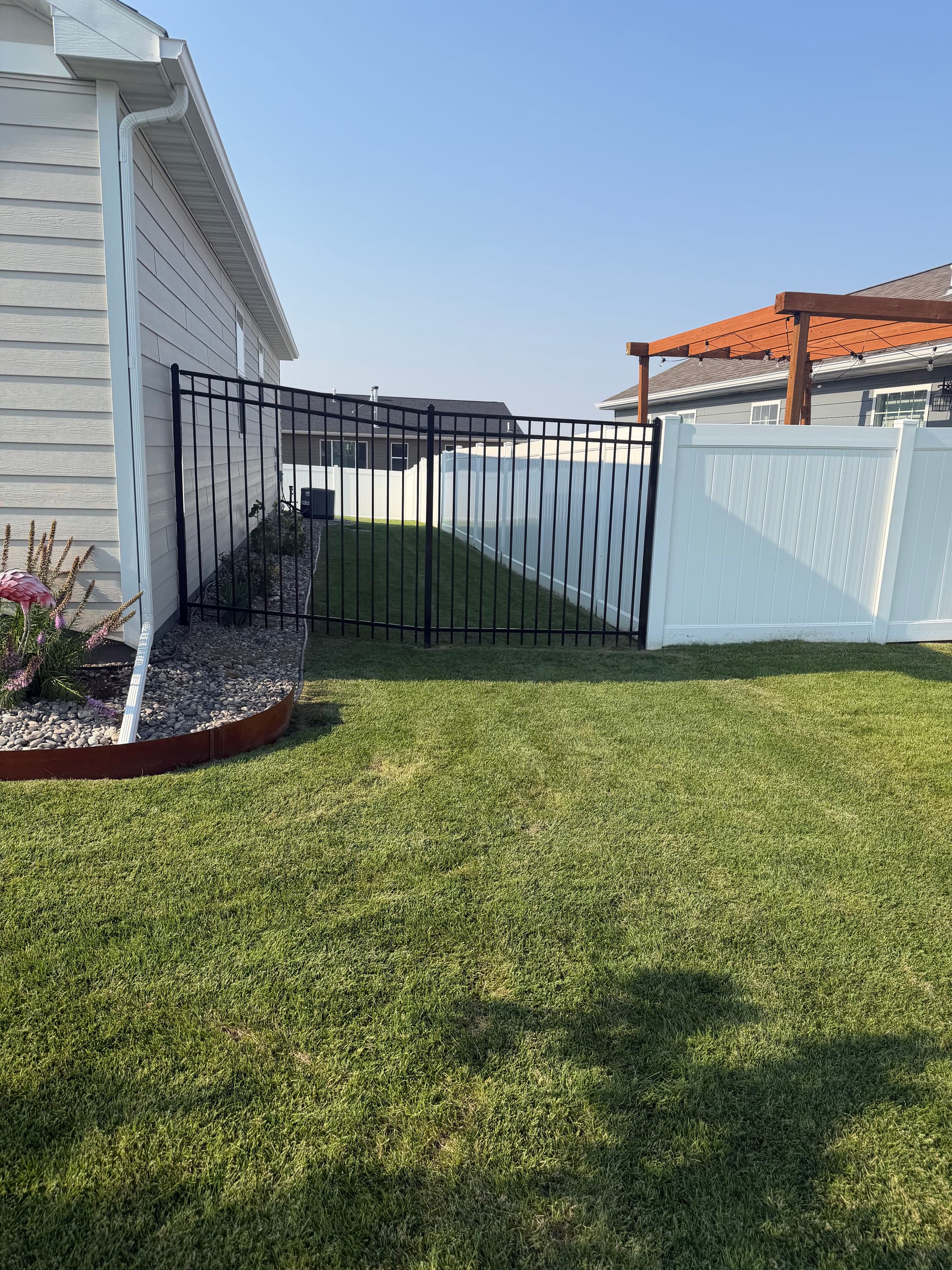 Gallery photos for White Vinyl Privacy Fence with Ornamental Gate Installation: Image #1