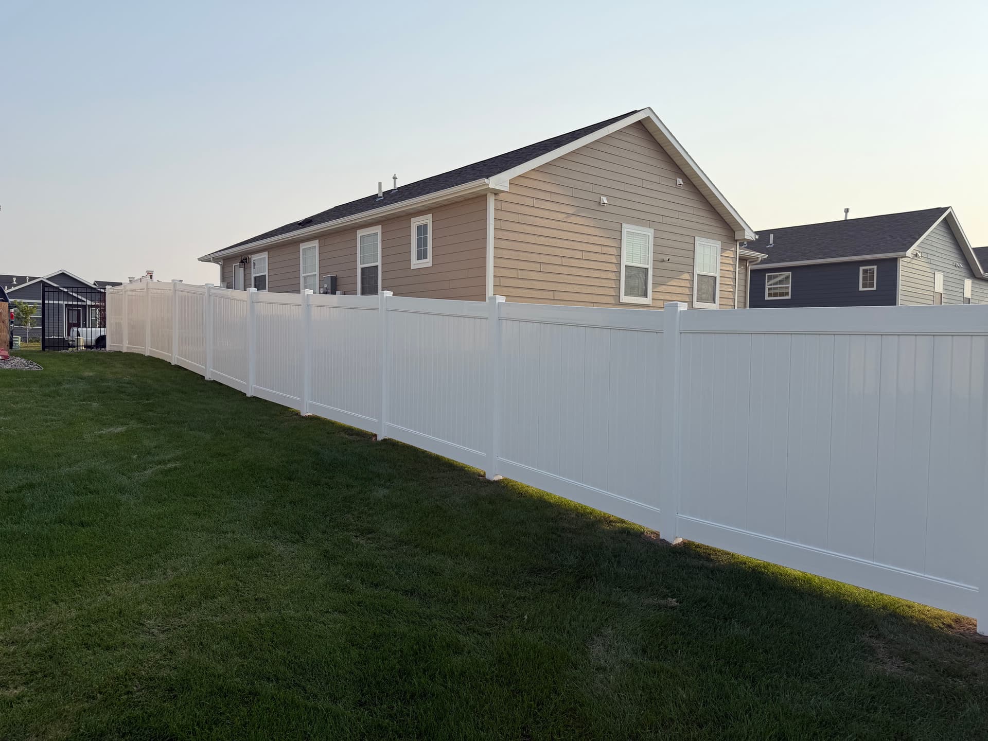 Gallery photos for White Vinyl Privacy Fence with Ornamental Gate Installation: Image #2