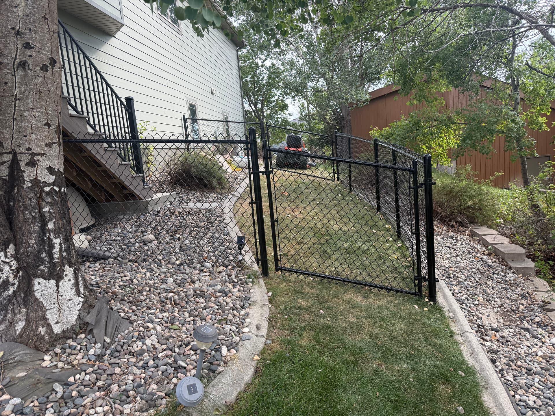 Gallery photos for 4-Foot Black Chain Link Dog Kennel Built Off the Deck: Image #1