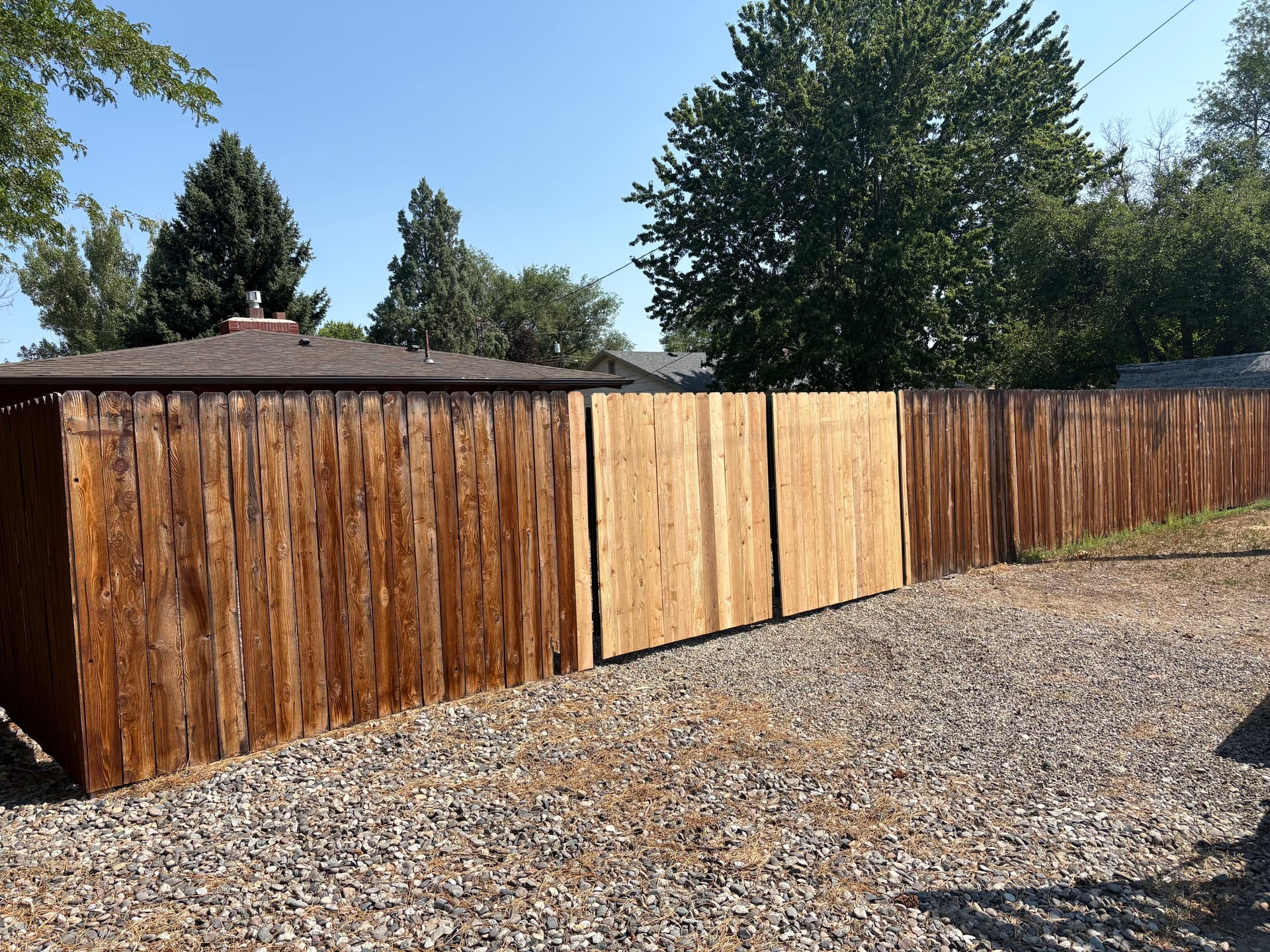 New Wood Posts and Double Gate Bring This Fence Back to Life image