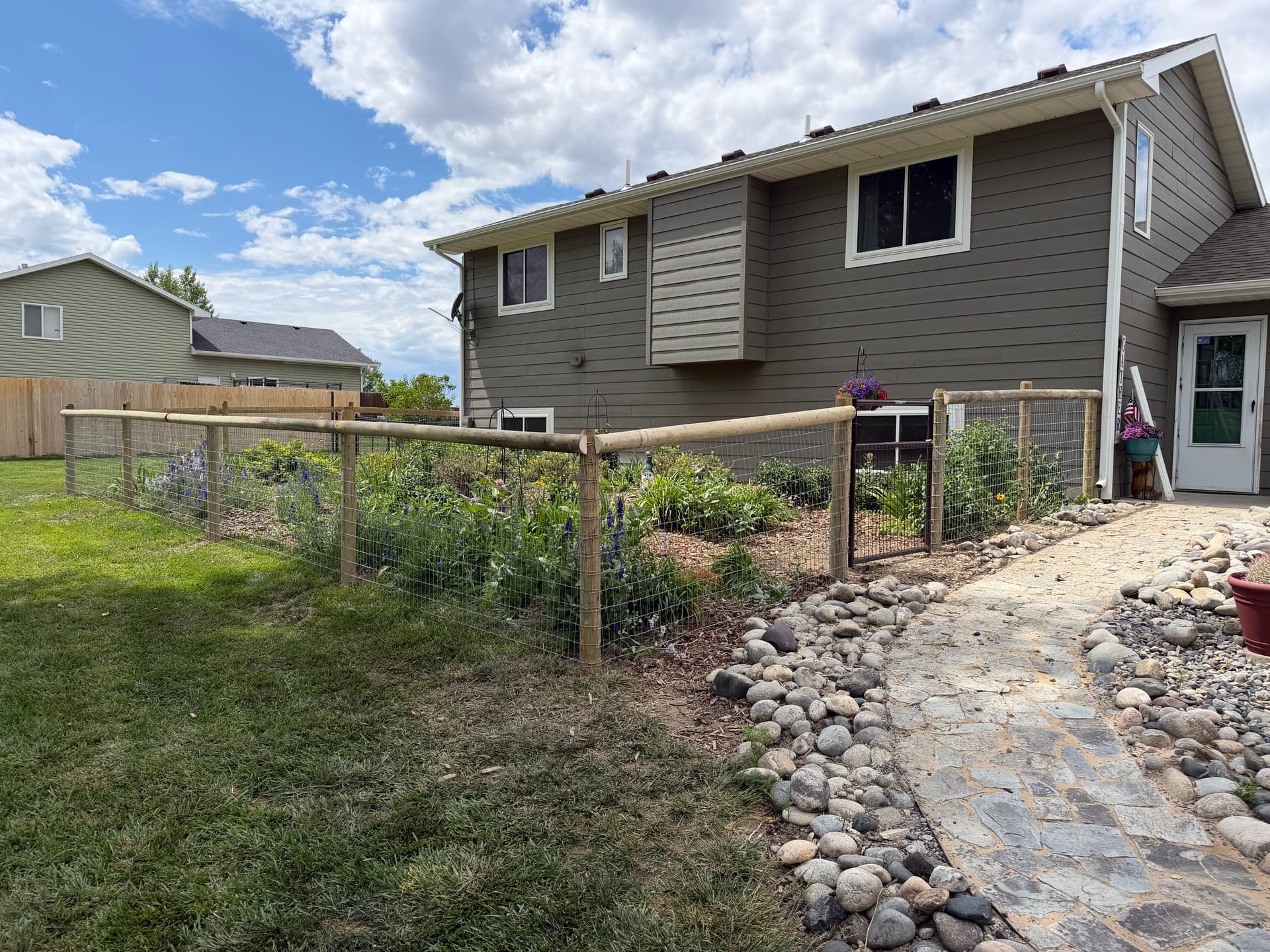 Gallery photos for Garden Fence Build That Keeps Dogs Out and Flowers Thriving: Image #1
