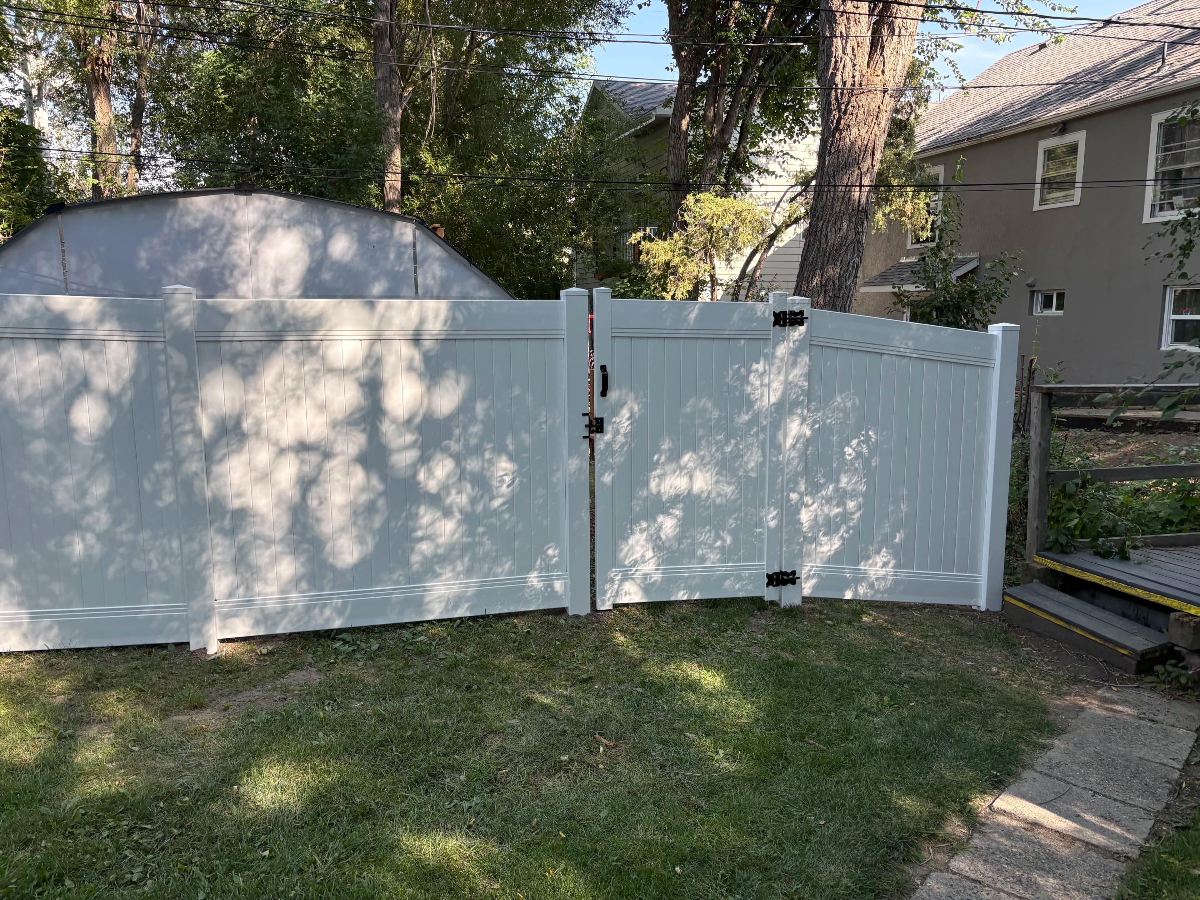 Project Vinyl Privacy Fence and Gate Installation for a Family Backyard image