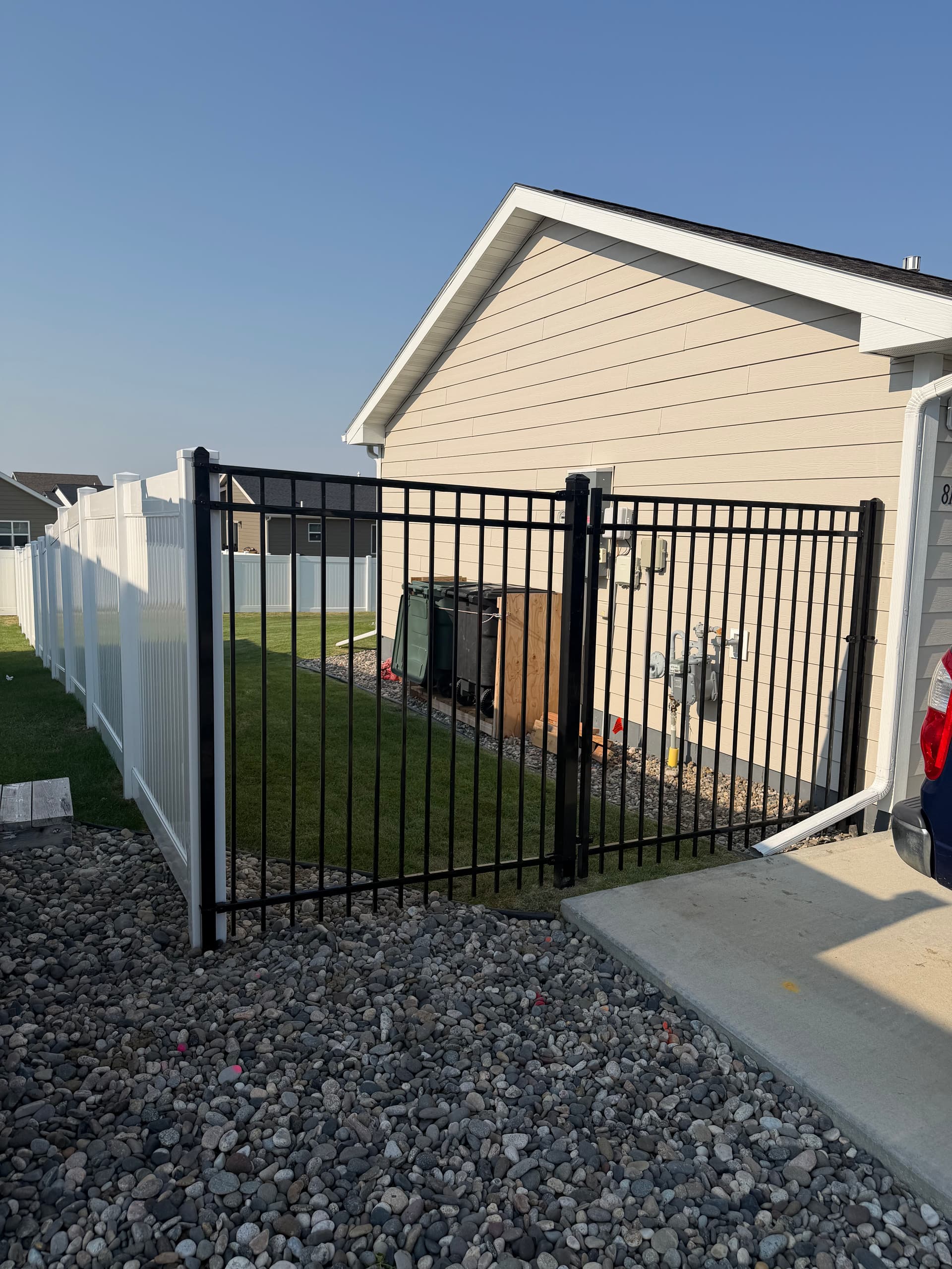 White Vinyl Privacy Fence with Ornamental Gate Installation