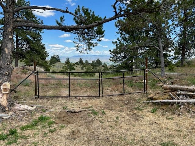 Woven Wire and Steel Gate Installation in Bridger image