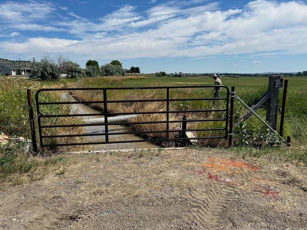 Sturdy Access Gate Installed for Irrigation Canal image