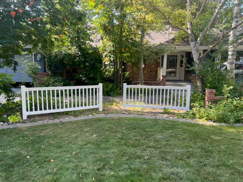 Elegant White Vinyl Fence Enhances Home Privacy image