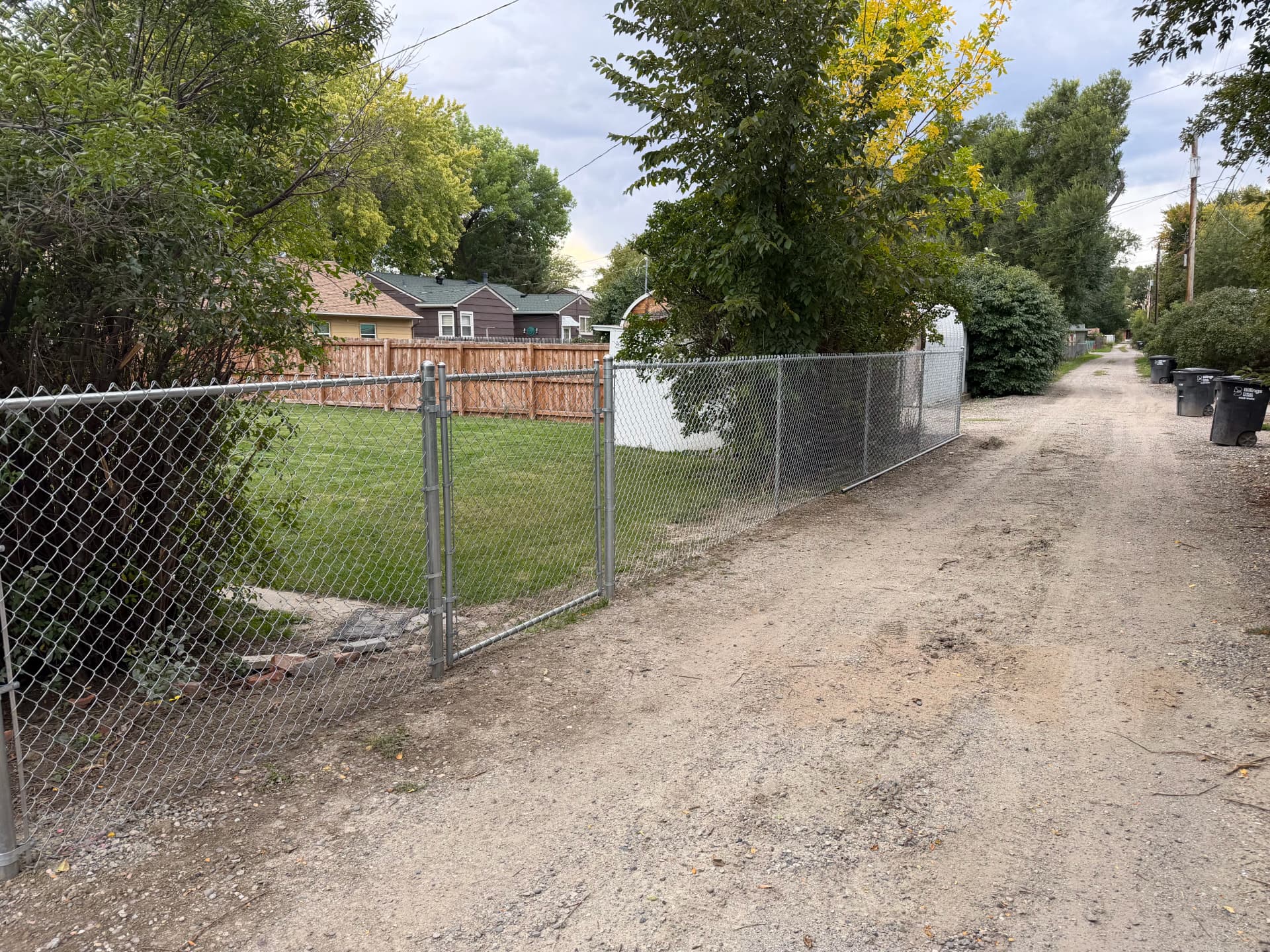 5-Foot Chain Link Fence Fully Encloses Backyard Along Alleyway image