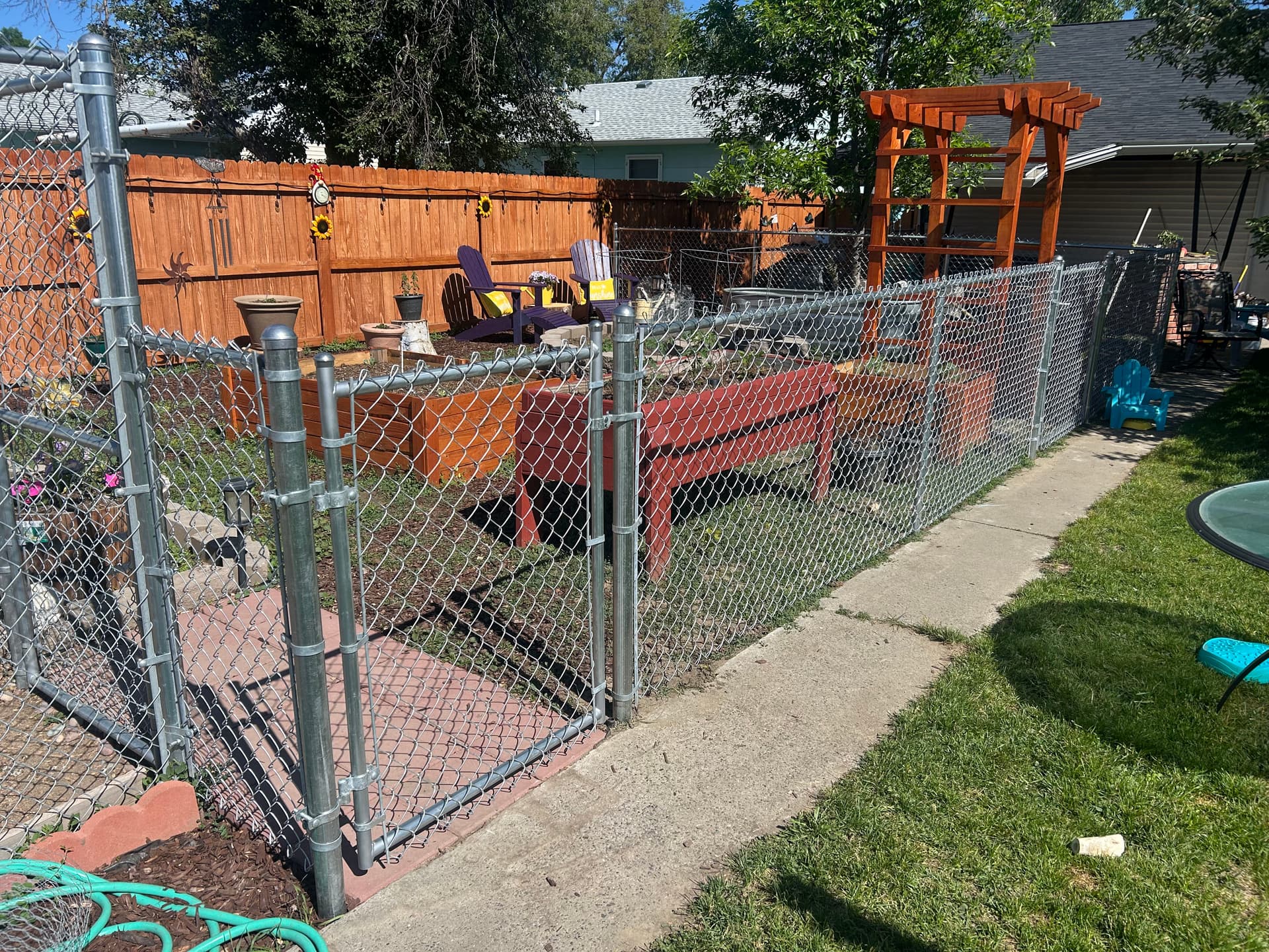Chain Link Fence Keeps Garden Safe and Dogs Out image