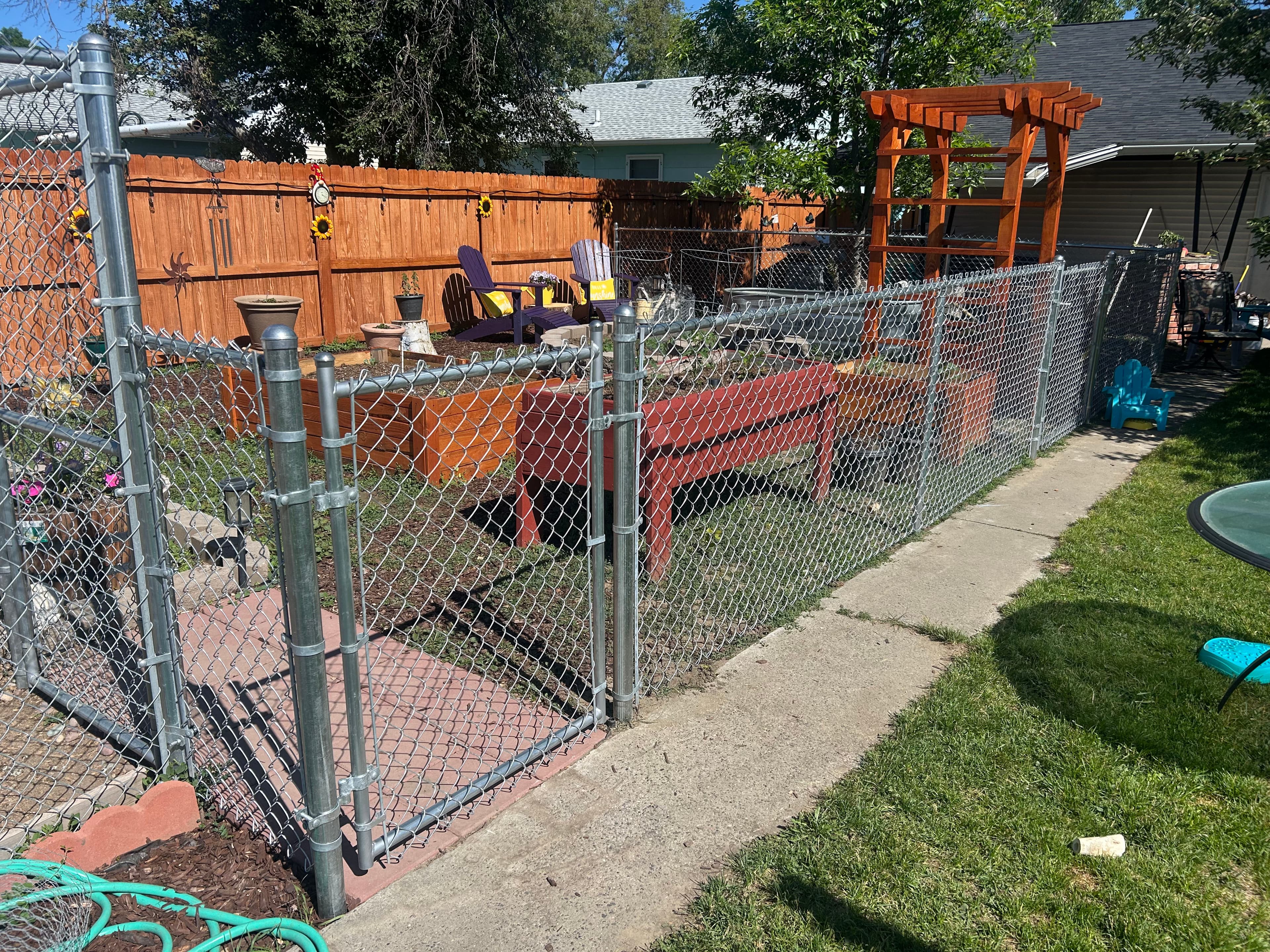 Project Chain Link Fence Keeps Garden Safe and Dogs Out image